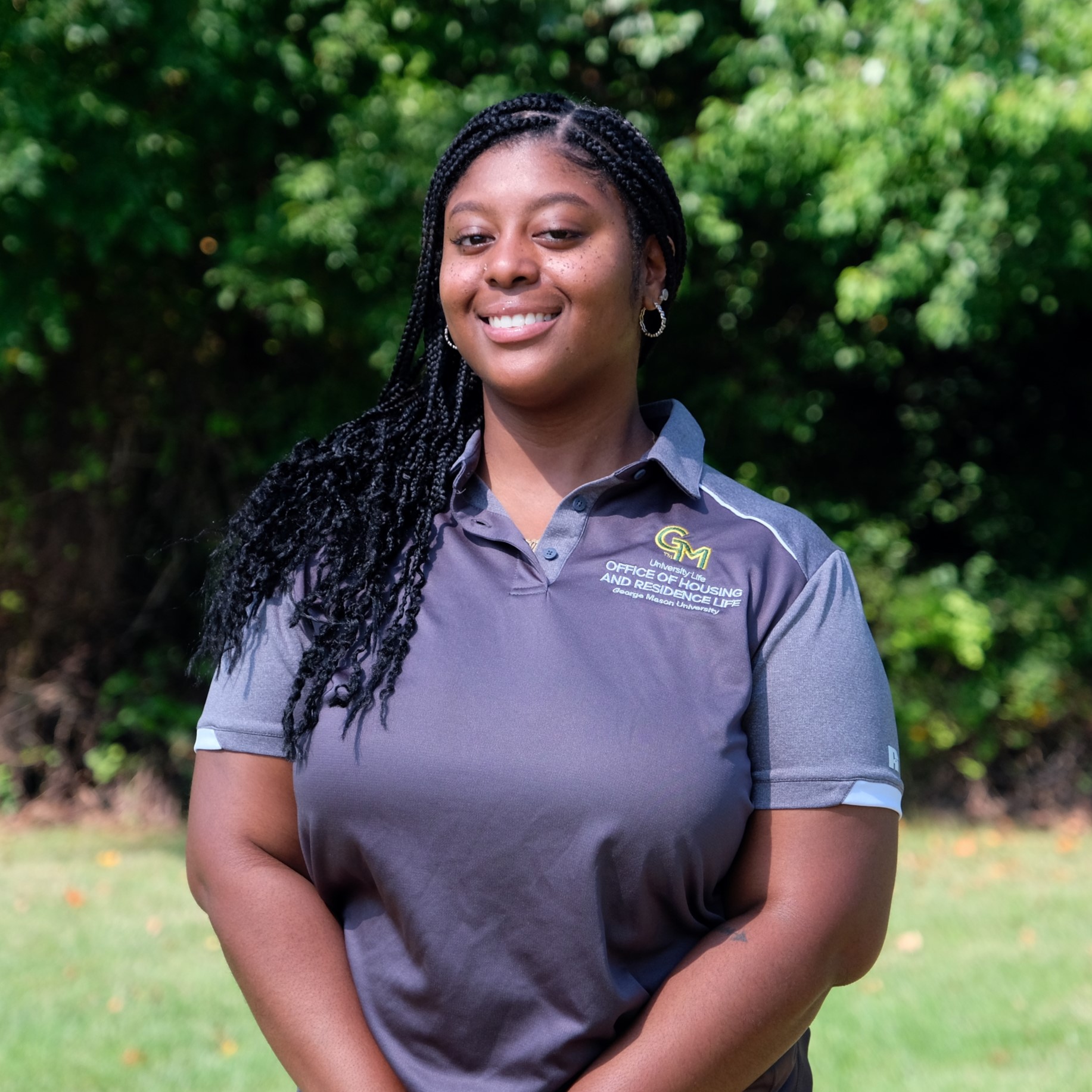 Taliyah Rogers in a grey mason polo smiling