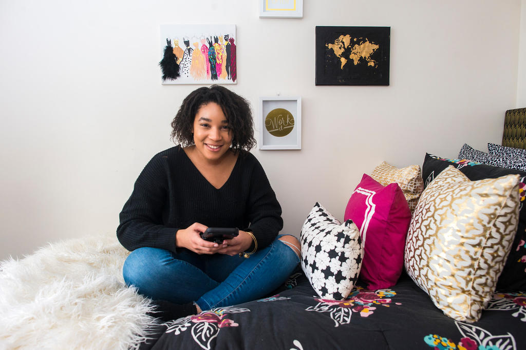 A GMU student in her dorm room.