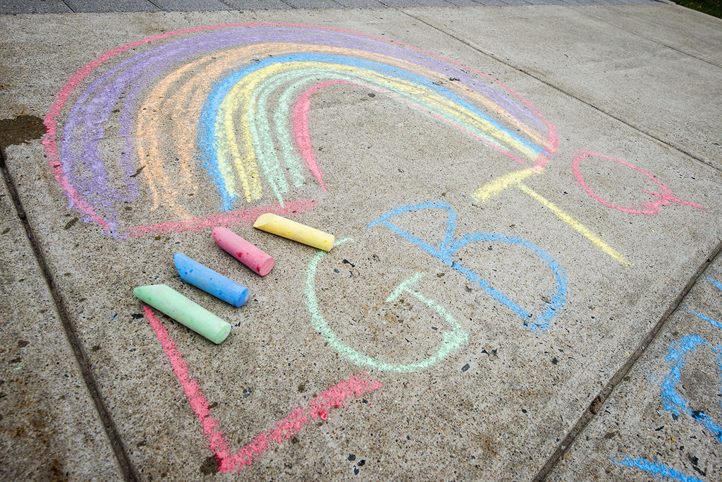 LGBTQ written in chalk on the sidewalk